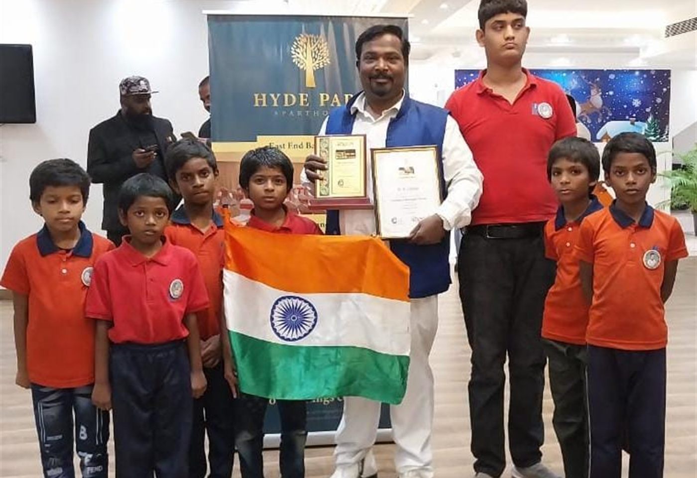 Children celebrating a national festival with the flag